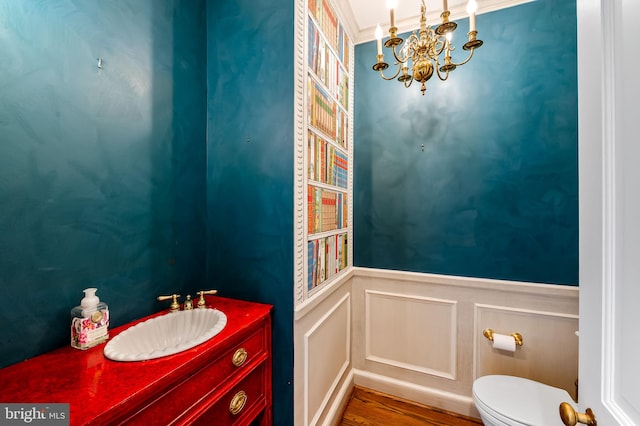 6316 Mossway, Baltimore, MD 21212 - half bath with a chandelier, a decorative wall, ornamental molding, vanity, and wainscoting
