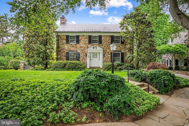 6316 Mossway, Baltimore, MD 21212 - view of front of house featuring a high end roof, a chimney, and a front yard