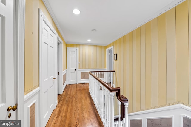 6316 Mossway, Baltimore, MD 21212 - hall featuring light wood-type flooring, recessed lighting, wallpapered walls, a decorative wall, and an upstairs landing