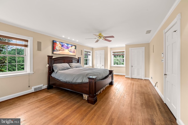 6316 Mossway, Baltimore, MD 21212 - bedroom with light wood finished floors, crown molding, a ceiling fan, recessed lighting, and multiple closets