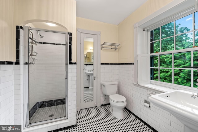 6316 Mossway, Baltimore, MD 21212 - full bathroom featuring a stall shower, a wainscoted wall, and tile walls