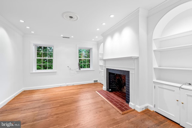 6316 Mossway, Baltimore, MD 21212 - unfurnished living room with ornamental molding, built in features, a fireplace, light wood finished floors, and recessed lighting