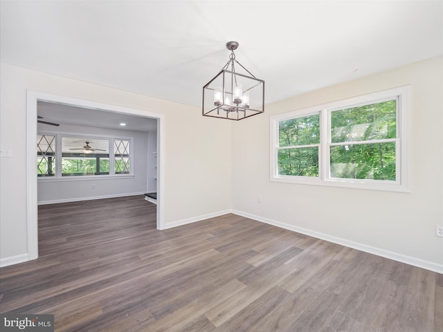 502 Windsong Rd, Harpers Ferry, WV 25425 - unfurnished room featuring dark wood-style floors and a chandelier