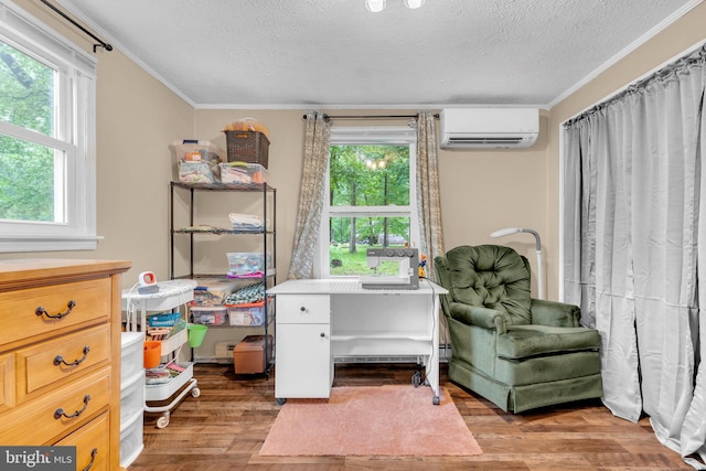 7570 Independence Cir, Charlotte Hall, MD 20622 - living area with a wall unit AC, ornamental molding, a textured ceiling, and wood finished floors