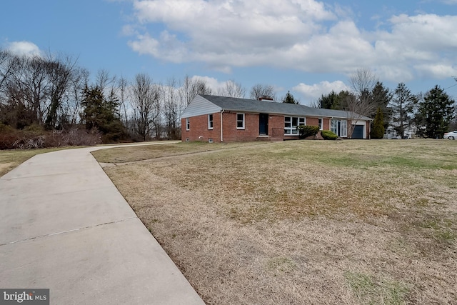 2502 Rancocas Rd, Burlington, NJ 08016 - ranch-style house with brick siding, concrete driveway, a chimney, a front yard, and an attached garage