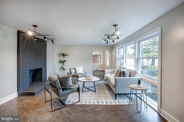 2502 Rancocas Rd, Burlington, NJ 08016 - living area with arched walkways and a fireplace