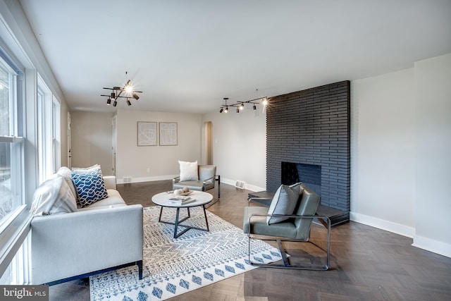 2502 Rancocas Rd, Burlington, NJ 08016 - living area featuring arched walkways, healthy amount of natural light, and a brick fireplace