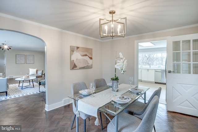 2502 Rancocas Rd, Burlington, NJ 08016 - dining room with a chandelier, arched walkways, and ornamental molding
