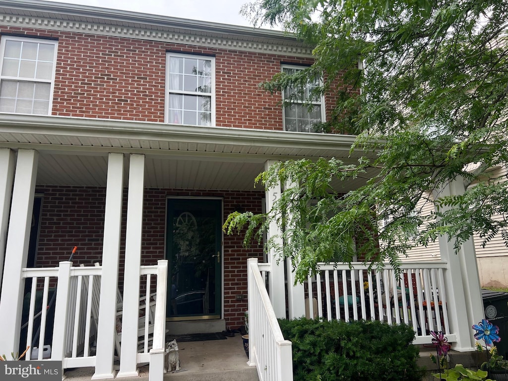 521 May St, Pottstown, PA 19464 - doorway to property featuring brick siding and covered porch