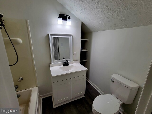 110 N Mulberry St, Hagerstown, MD 21740 - full bath with a textured ceiling, vanity, vaulted ceiling, wood finished floors, and shower / bath combination