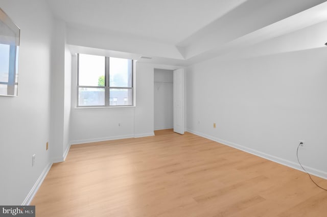 4808 Moorland Ln Unit 613, Bethesda, MD 20814 - unfurnished bedroom featuring light wood-type flooring and a closet