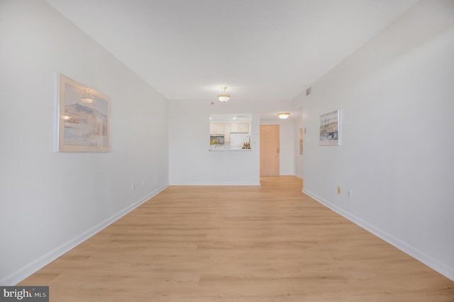 4808 Moorland Ln Unit 613, Bethesda, MD 20814 - spare room featuring light wood-style flooring and baseboards