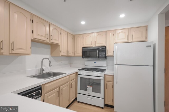 4808 Moorland Ln Unit 613, Bethesda, MD 20814 - kitchen featuring white appliances, light countertops, recessed lighting, and light wood-style floors