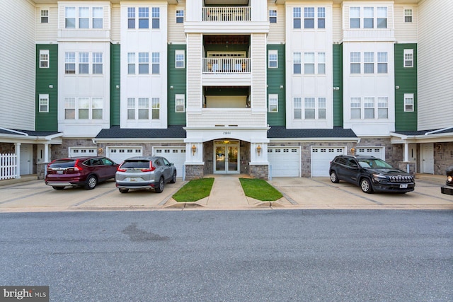 13801 Belle Chasse Blvd Unit 213, Laurel, MD 20707 - view of property with driveway and a garage