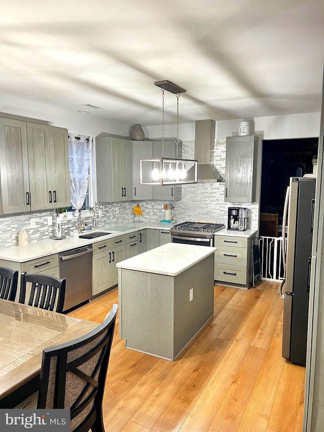 1411 Whispering Woods Ct, Williamstown, NJ 08094 - kitchen featuring stainless steel appliances, gray cabinetry, wall chimney exhaust hood, and tasteful backsplash