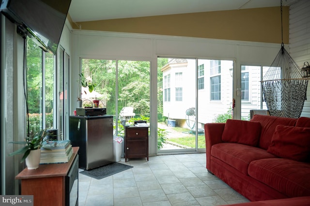 1411 Whispering Woods Ct, Williamstown, NJ 08094 - sunroom / solarium with lofted ceiling, plenty of natural light, a decorative wall, and tile patterned floors