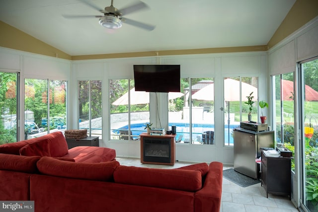 1411 Whispering Woods Ct, Williamstown, NJ 08094 - living area with lofted ceiling, a ceiling fan, and a decorative wall