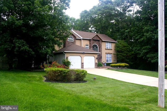 1411 Whispering Woods Ct, Williamstown, NJ 08094 - traditional-style house with stone siding, a garage, a front yard, concrete driveway, and stucco siding