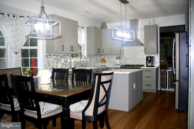 1411 Whispering Woods Ct, Williamstown, NJ 08094 - kitchen featuring gray cabinets, a chandelier, light countertops, tasteful backsplash, and wall chimney range hood
