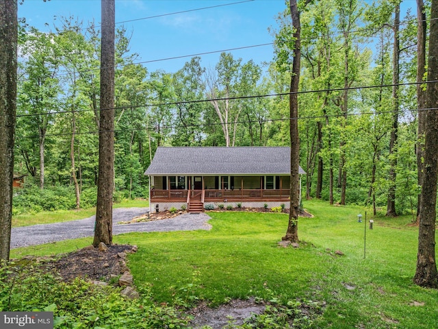 295 Rocky Mount Rd, Linden, VA 22642 - view of front of property with a porch, a front lawn, a shingled roof, and a forest view