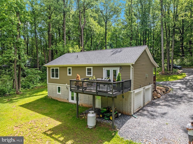 295 Rocky Mount Rd, Linden, VA 22642 - back of house with a wooden deck, gravel driveway, a garage, a yard, and roof with shingles