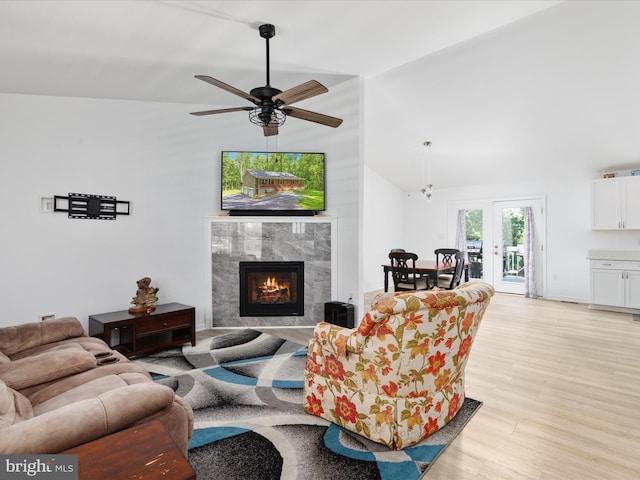 295 Rocky Mount Rd, Linden, VA 22642 - living area featuring light wood finished floors, lofted ceiling, a premium fireplace, and ceiling fan