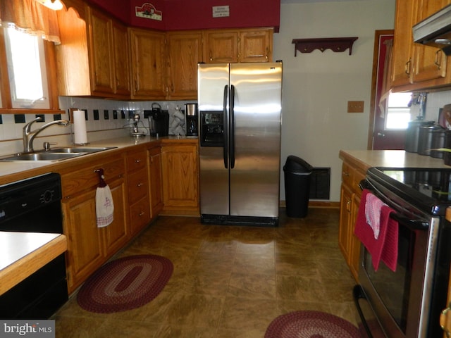201 Cherry St, Millheim, PA 16854 - kitchen with stainless steel appliances, light countertops, ventilation hood, and brown cabinetry