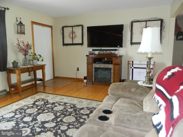 201 Cherry St, Millheim, PA 16854 - living area with wood finished floors and a fireplace