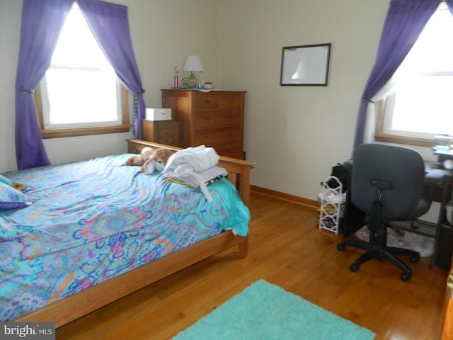201 Cherry St, Millheim, PA 16854 - bedroom featuring multiple windows and wood finished floors