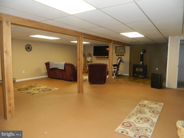 201 Cherry St, Millheim, PA 16854 - finished below grade area featuring a paneled ceiling and a wood stove