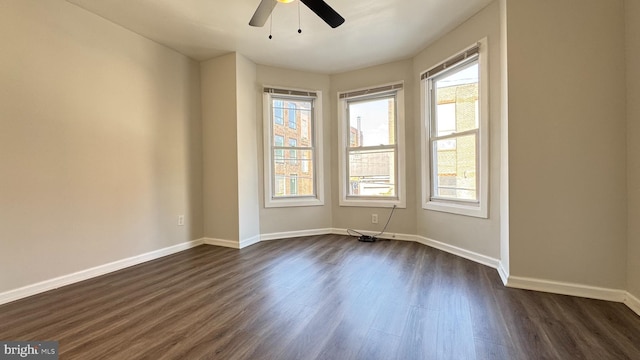 3436 D St, Philadelphia, PA 19134 - empty room featuring dark wood finished floors, healthy amount of natural light, and a ceiling fan