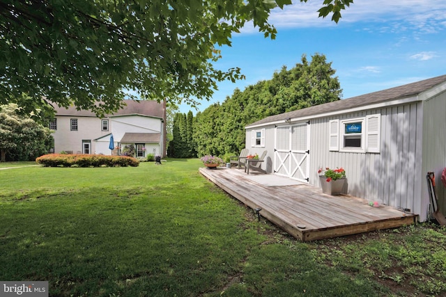 7404 Boyertown Pi, Douglassville, PA 19518 - view of grassy yard with an outdoor structure and a wooden deck