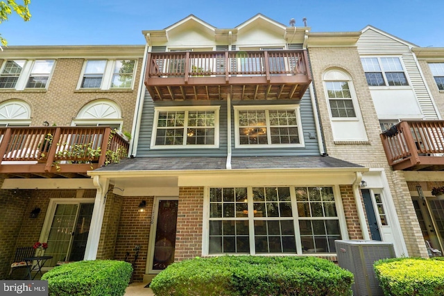 11736 Rockaway Ln Unit 101, Fairfax, VA 22030 - rear view of house featuring a balcony and brick siding