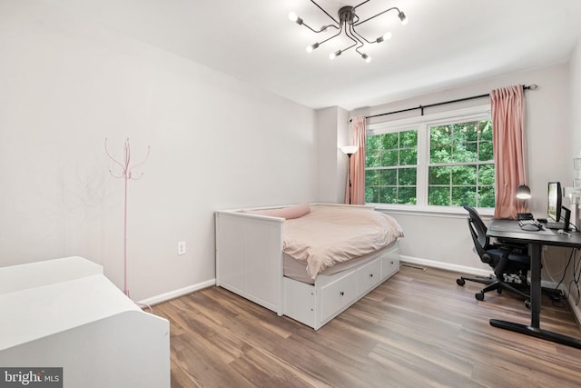 11736 Rockaway Ln Unit 101, Fairfax, VA 22030 - bedroom featuring wood finished floors, a chandelier, and a desk