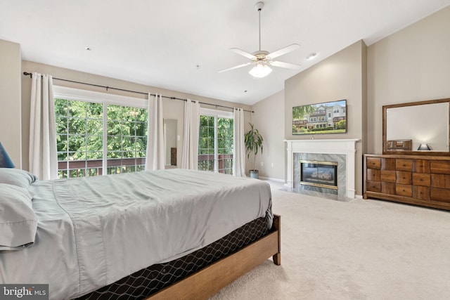 11736 Rockaway Ln Unit 101, Fairfax, VA 22030 - bedroom with access to outside, vaulted ceiling, carpet floors, a high end fireplace, and a ceiling fan
