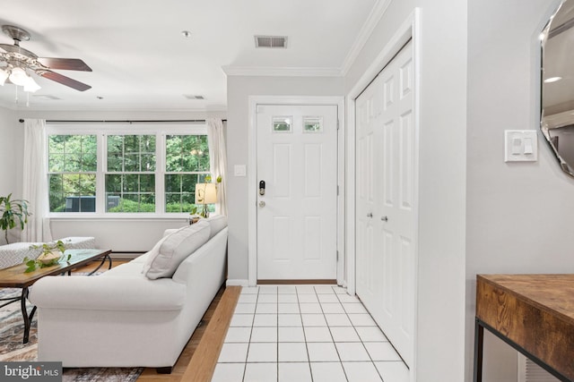 11736 Rockaway Ln Unit 101, Fairfax, VA 22030 - foyer entrance featuring ceiling fan, ornamental molding, and light wood-style flooring