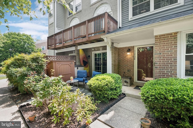 11736 Rockaway Ln Unit 101, Fairfax, VA 22030 - view of exterior entry with brick siding and a balcony