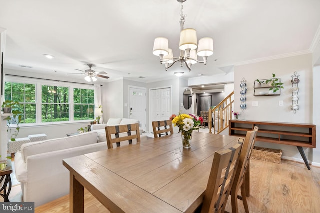 11736 Rockaway Ln Unit 101, Fairfax, VA 22030 - dining area featuring stairway, crown molding, a ceiling fan, light wood-type flooring, and a chandelier