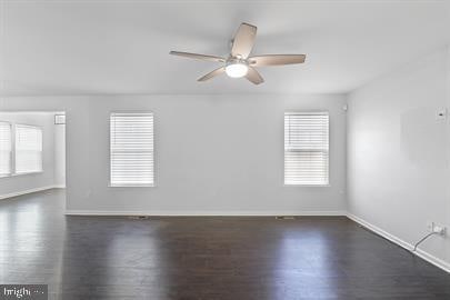 362 Harvest Grove Trl, Dover, DE 19901 - spare room with dark wood-type flooring and ceiling fan
