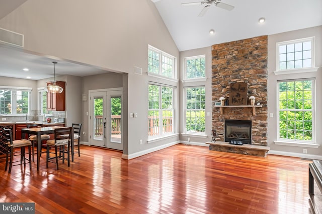 42066 Fiddlehead Pl, Aldie, VA 20105 - living room featuring wood-type flooring, a ceiling fan, plenty of natural light, and high vaulted ceiling