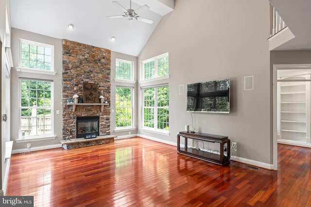 42066 Fiddlehead Pl, Aldie, VA 20105 - unfurnished living room with high vaulted ceiling, ceiling fan, hardwood / wood-style floors, and a fireplace