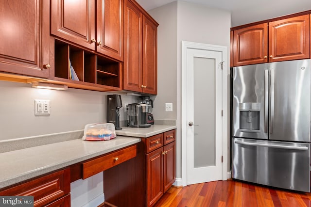 42066 Fiddlehead Pl, Aldie, VA 20105 - kitchen with stainless steel fridge with ice dispenser, light countertops, dark wood-style flooring, and open shelves