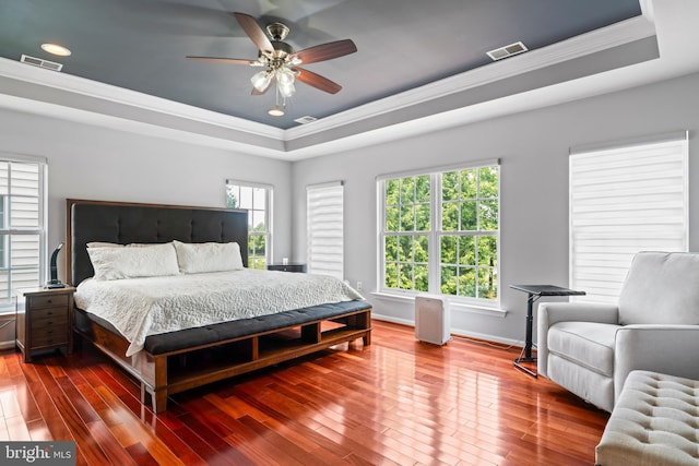 42066 Fiddlehead Pl, Aldie, VA 20105 - bedroom with a tray ceiling, crown molding, multiple windows, wood finished floors, and recessed lighting