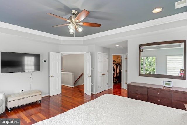 42066 Fiddlehead Pl, Aldie, VA 20105 - bedroom featuring wood finished floors, crown molding, recessed lighting, a spacious closet, and a ceiling fan