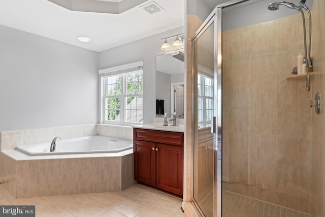 42066 Fiddlehead Pl, Aldie, VA 20105 - full bath with vanity, a bath, tile patterned flooring, and a stall shower