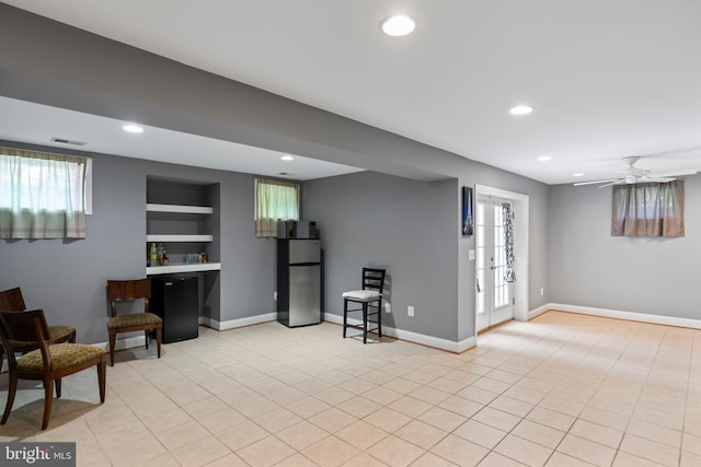 42066 Fiddlehead Pl, Aldie, VA 20105 - living area featuring recessed lighting, healthy amount of natural light, built in shelves, a ceiling fan, and light tile patterned flooring
