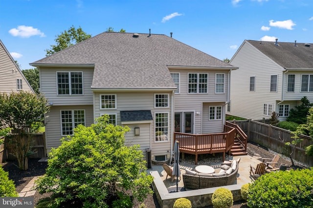 42066 Fiddlehead Pl, Aldie, VA 20105 - rear view of house with a deck, roof with shingles, a fenced backyard, a patio, and a fire pit