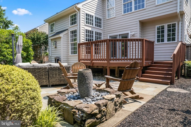 42066 Fiddlehead Pl, Aldie, VA 20105 - back of property featuring a wooden deck and a patio area
