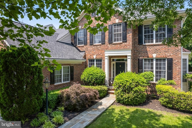 42066 Fiddlehead Pl, Aldie, VA 20105 - view of front facade featuring brick siding and roof with shingles