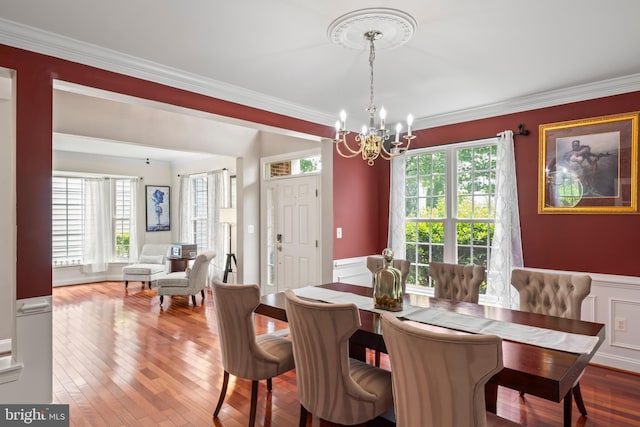 42066 Fiddlehead Pl, Aldie, VA 20105 - dining room with a chandelier, ornamental molding, plenty of natural light, wainscoting, and a decorative wall